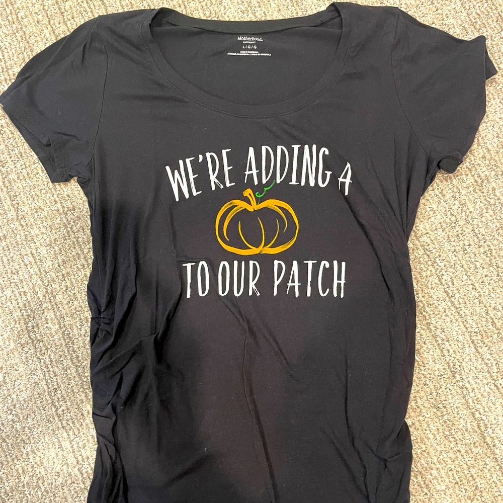 Motherhood Maternity adding a pumpkin to our patch baby news shirt